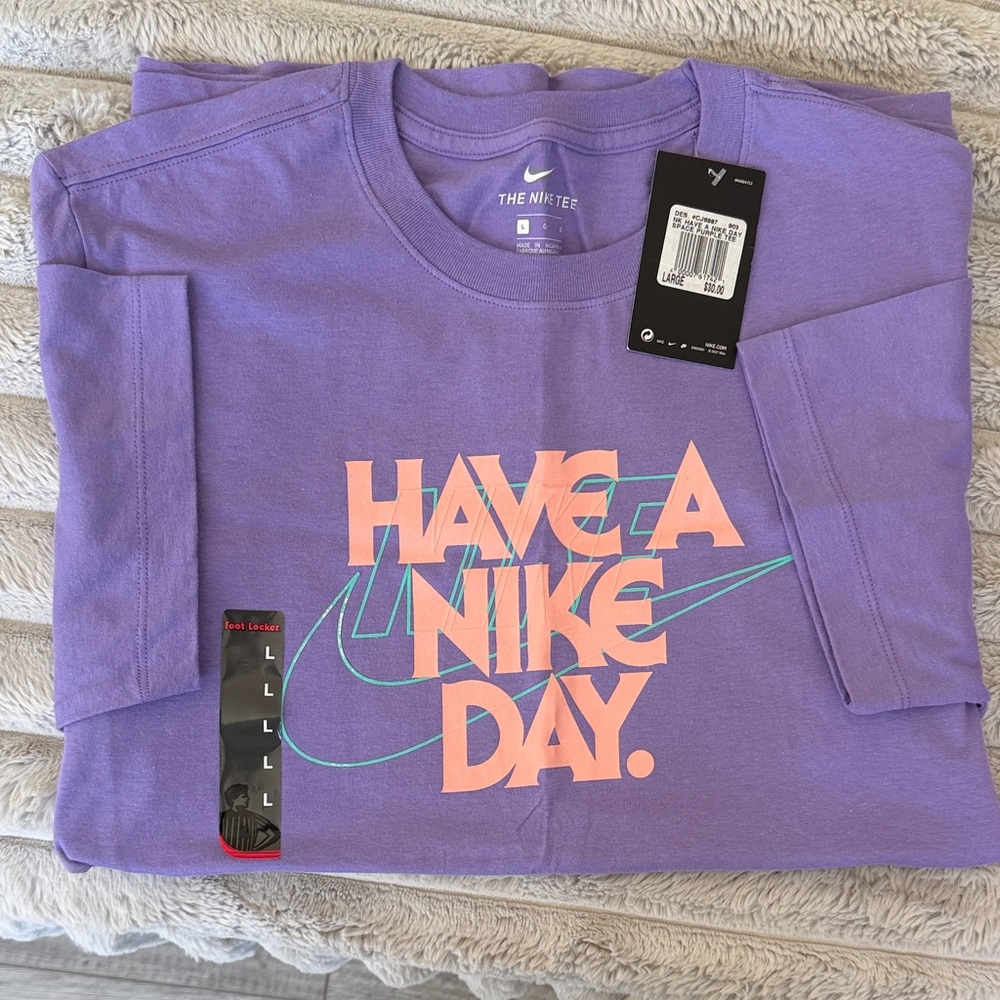 Nike Lavender Graphic Tee with Peach Text and Teal Swoosh